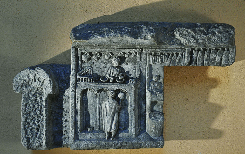 Relief carving with wine-sellers counter